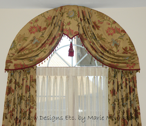 Arched window treatment swags on an arched top window. See more at www.windowdesignsetc.com by Marie Mouradian