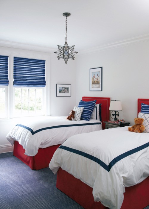 White twin bedroom with blue and white stripe Roman shades. 4th of July red, white and blue guest room