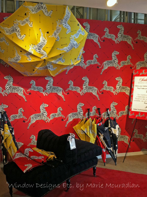 Scalamandré Wallpaper and Umbrellas at the Boston Design Center showroom. Zebras on red and yellow. Scalamandre zebra. See more at www.windowdesignsetc.com by Marie Mouradian
