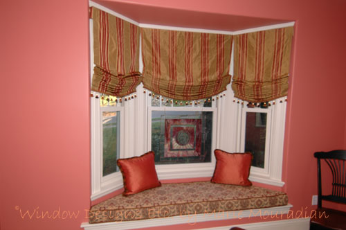 Tangerine Tango Interiors Walls, window seat, relaxed Roman shades and pillows in Worcester, MA Window Designs Etc. by Marie Mouradian