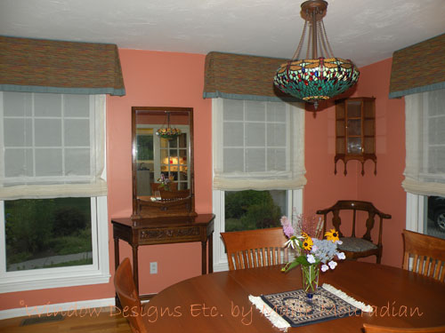 Tangerine Tango Interiors - Concord, Massachusetts dining room featuring tangerine tango walls. Box pleated valance with contrasting seafoam green banding over a sheer Roman shade.