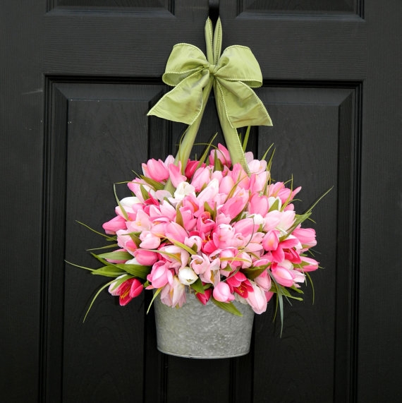 Spring home decorating tips - change your front door decor. Black door with a bucket of pink tulips. Window Designs Etc. by Marie Mouradian www.windowdesignsetc.com