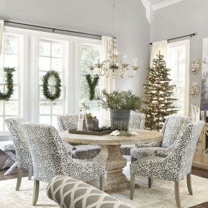 Monogram wreaths of JOY decorate this neutral dining area for windows decked out for the holidays
