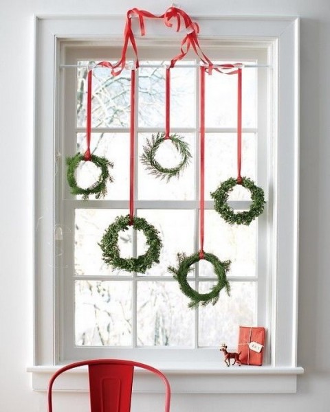 Red ribbons hang a collection of petite wreaths. WindowDesignsEtc.com Please come take a look at more ideas http://wp.me/p2RXdv-vv