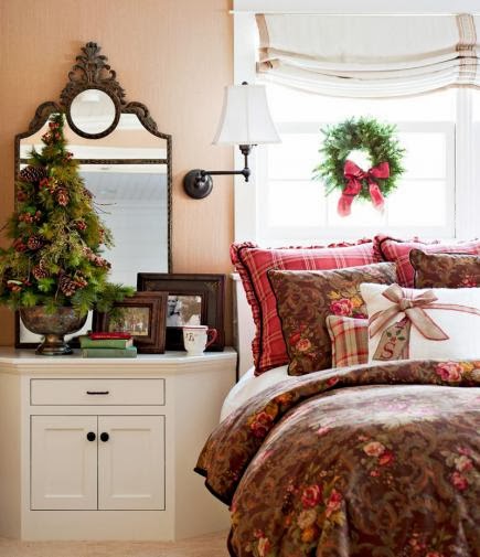 Wreath and roman shade above a bed. Holiday window decorating ideas