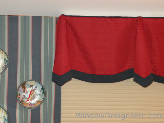 decorate with Red at Home. Red quilted scallop and cone valance with navy blue banding. Underneath is a Hunter Douglas Duette® Architella honeycomb shade. Designed and Created by Window Designs Etc. By Marie Mouradian