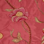 Embroidery Detail on coral pink silk fabric