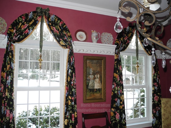 Arched top windows are adorned with a big bow and a glitzy statement ornament for the holidays. More on the blog www.windowdesignsetc.com