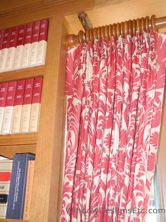Red and white damask patterned pleated drapes on wooden rod. Designed and Created by Window Designs Etc. By Marie Mouradian