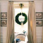 Roman shades and classic draperies are dressed for the holidays with a simple green wreath from House Beautiful. More on the blog www.windowdesignsetc.com