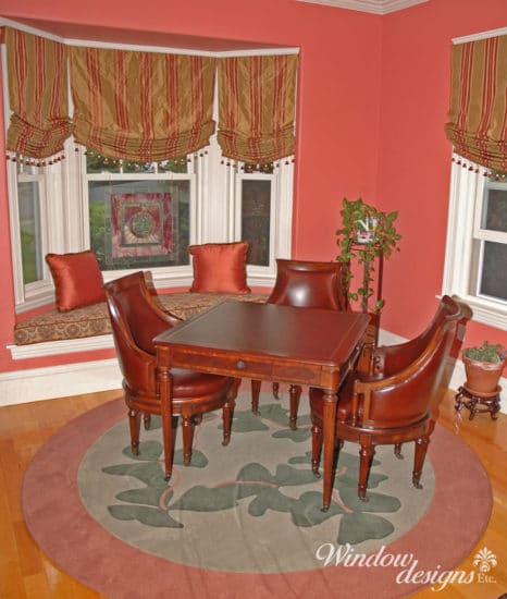 Worcester Craftsman home game area with window seat, custom area rug and relaxed Roman shades.