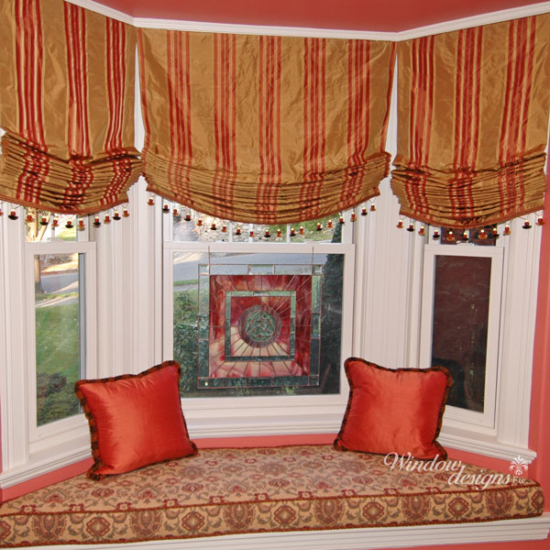 Roman shades are relaxed, hobbled, slatted or flat fold. Bay window seat with relaxed Roman shades Worcester, MA